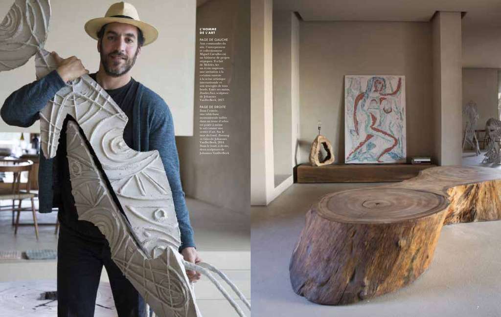 Cote Sud spread with a man holding a carved sculpture, and a tree-trunk table