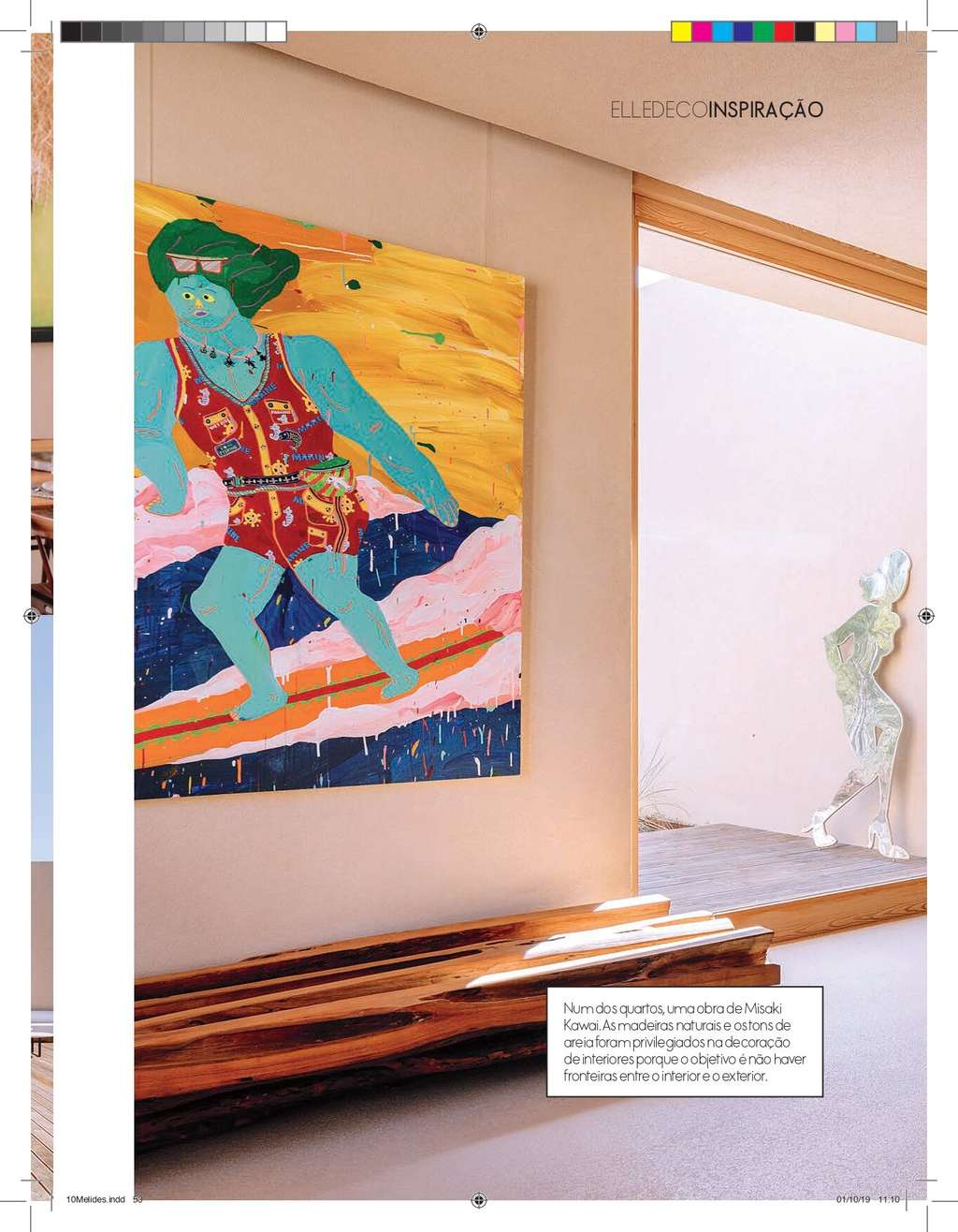 Elle Decoration page with a large colorful painting of a figure in a warm interior
