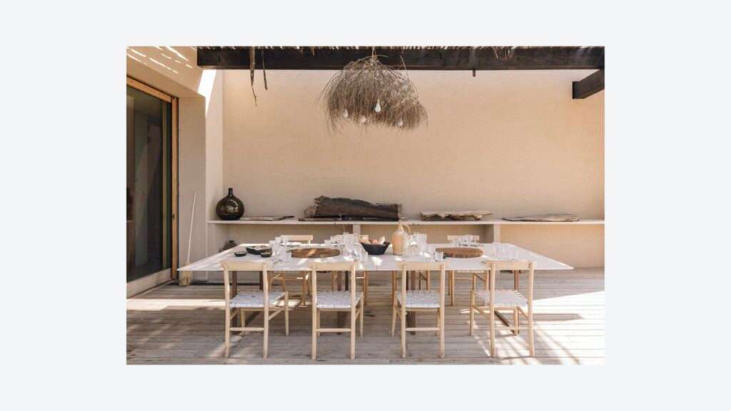 Visual Pleasure page with a long dining table under a pergola